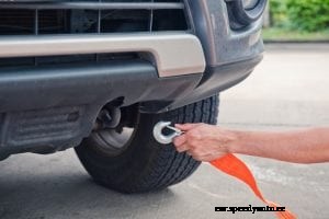 How to tow a vehicle yourself using a tow strap