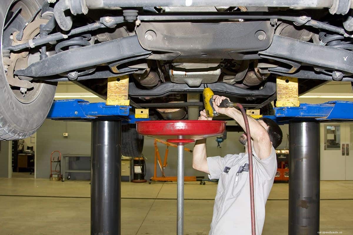 Why Is Pink Fluid Leaking From My Car? What Should I Do?