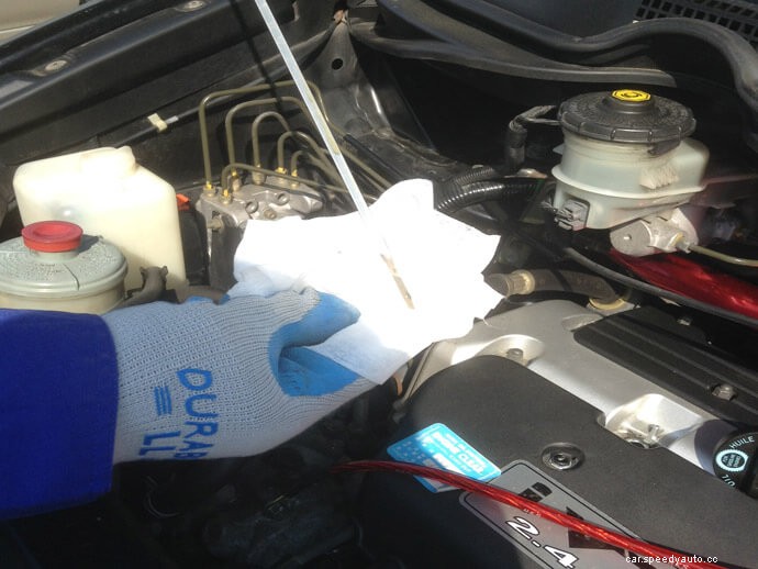 What should I do if the oil check lamp turns on?