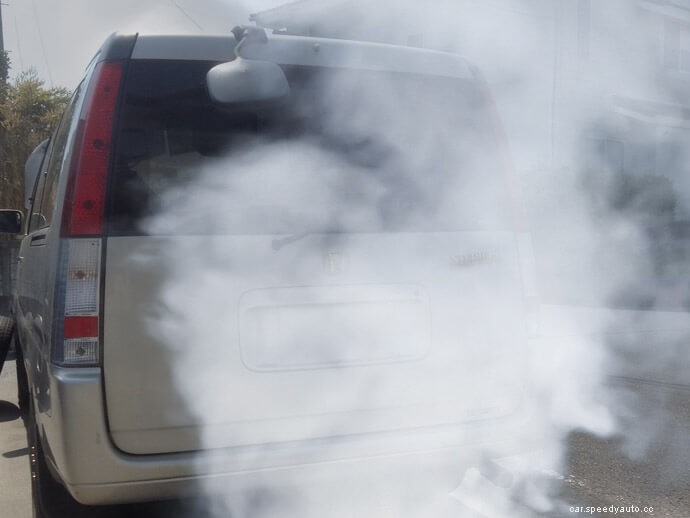What causes black or white smoke to come from a diesel car’s exhaust?